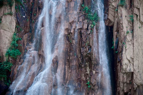 Waterfall Flowing Down on a Rocky Cliff