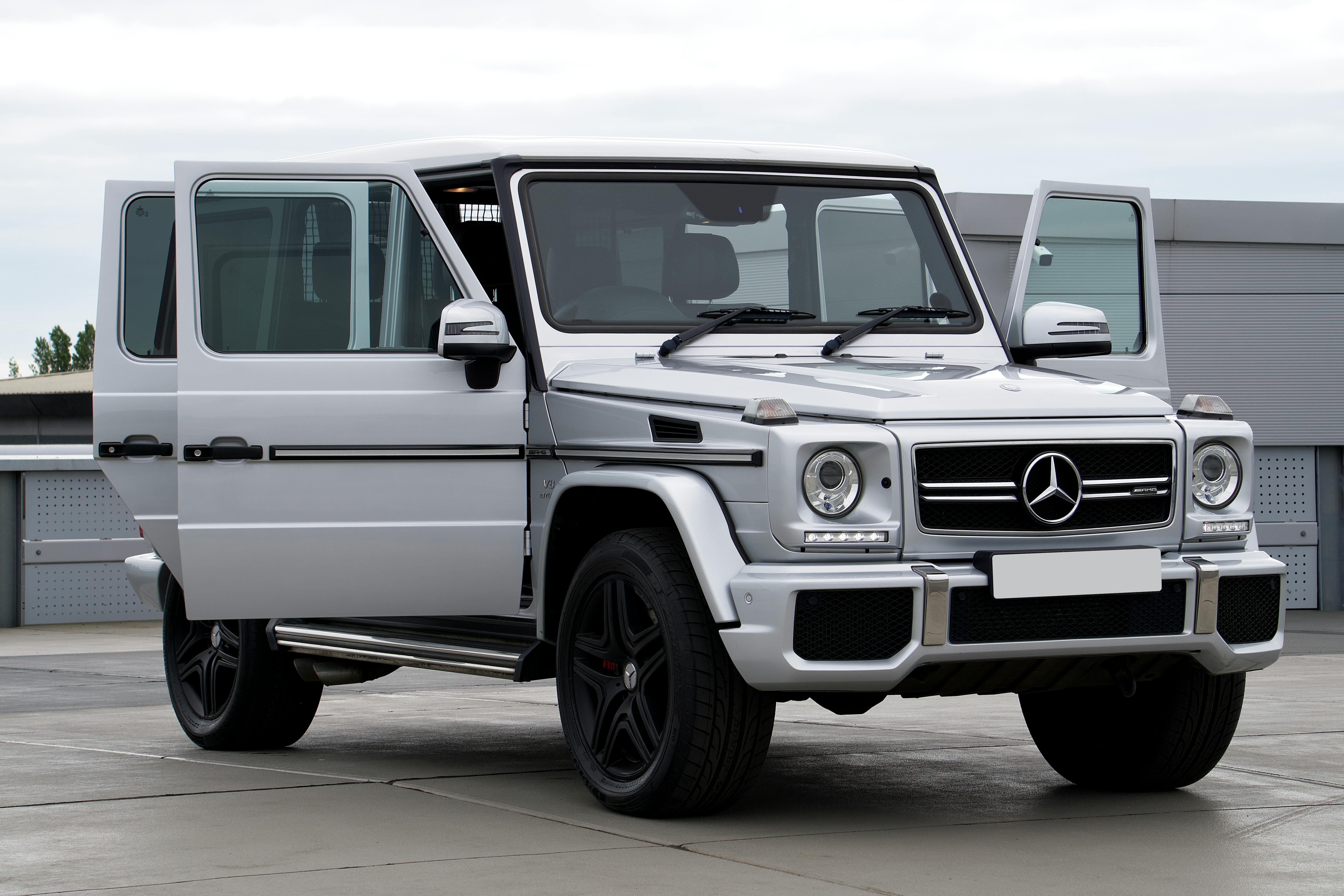 silver mercedes on a parking lot