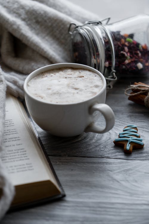 Cup Of Coffee Beside Open Book