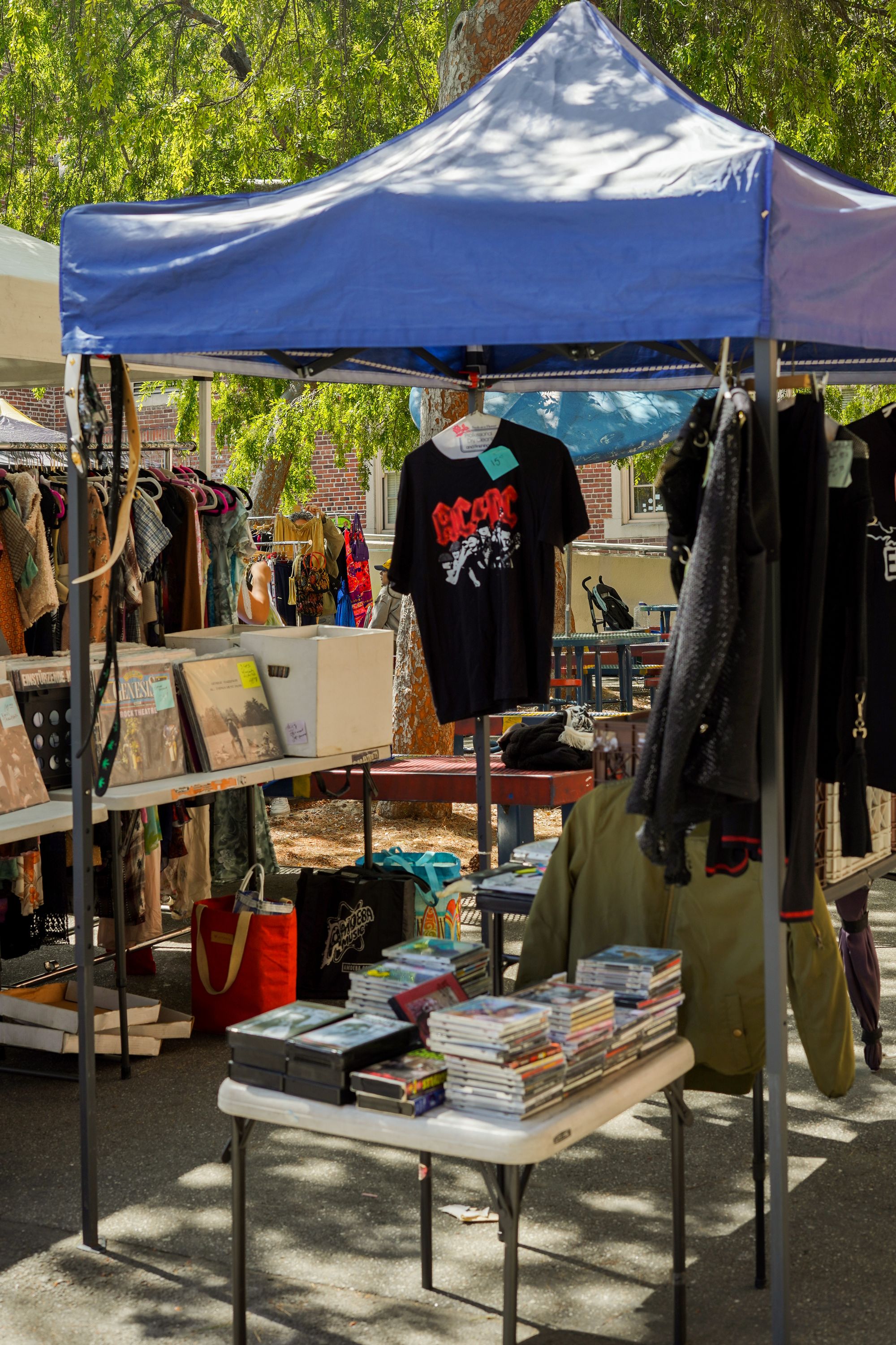 Vintage market stall filled with clothing, books and independent finds
