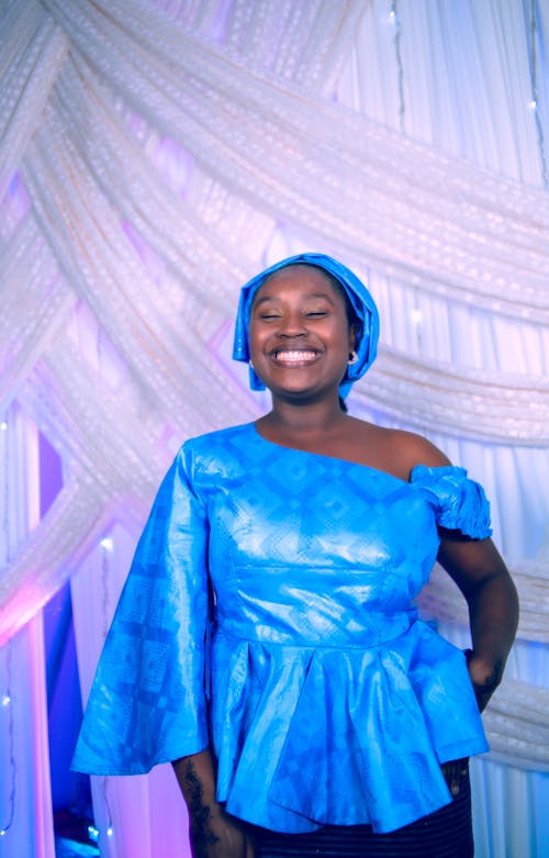 Smiling Woman in Blue Clothes