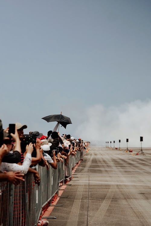 Photographers near Fence at Auto Racing