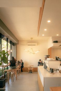 Warm and inviting café interior in Sacramento with people enjoying a relaxing atmosphere.