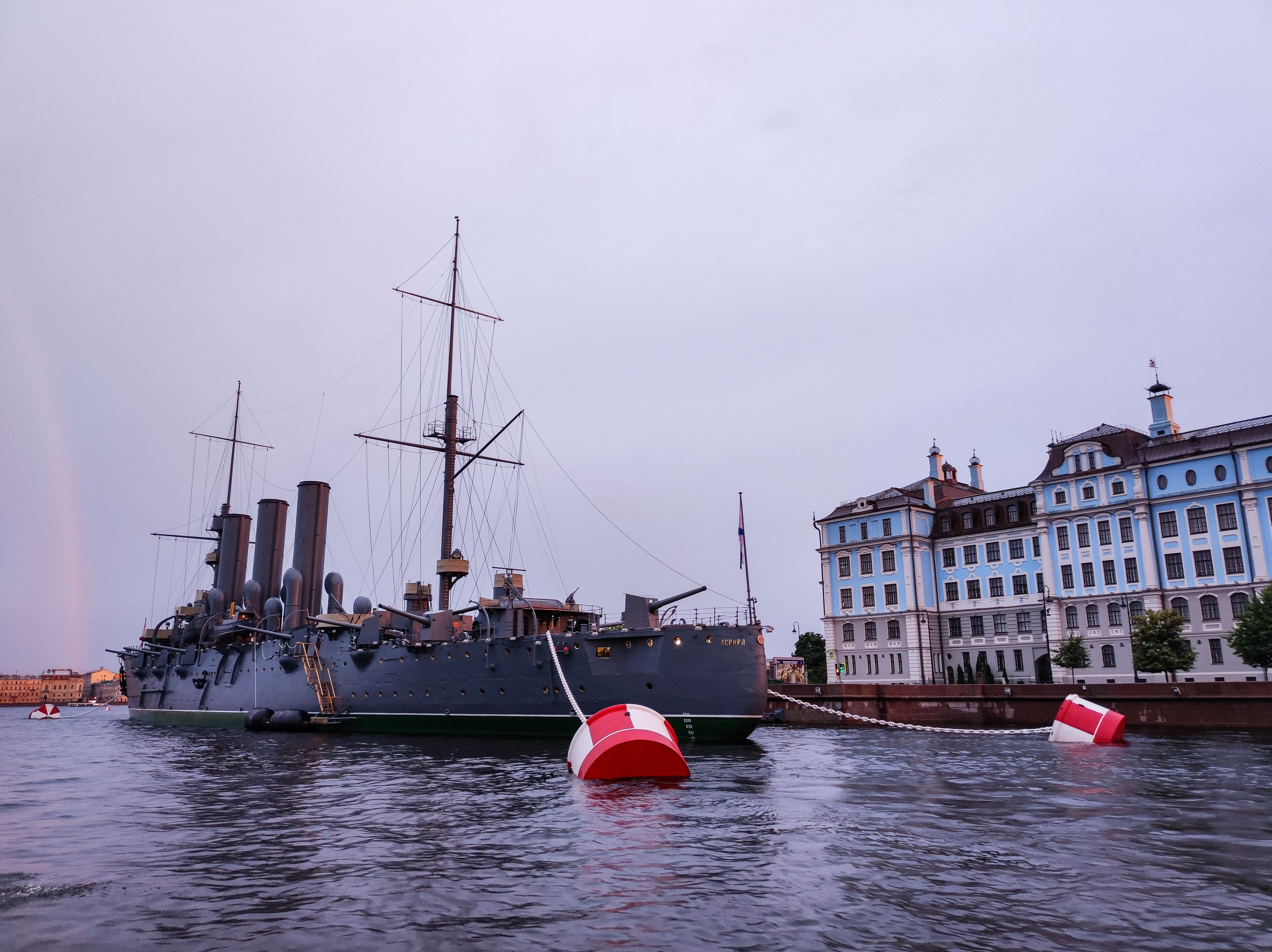 A grey naval vessel under an overcast sky