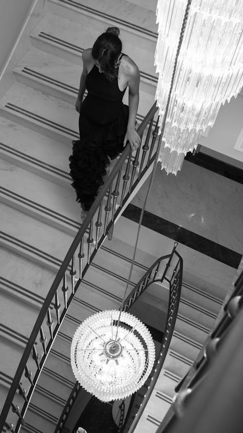 Elegant Woman Walking Down the Stairs