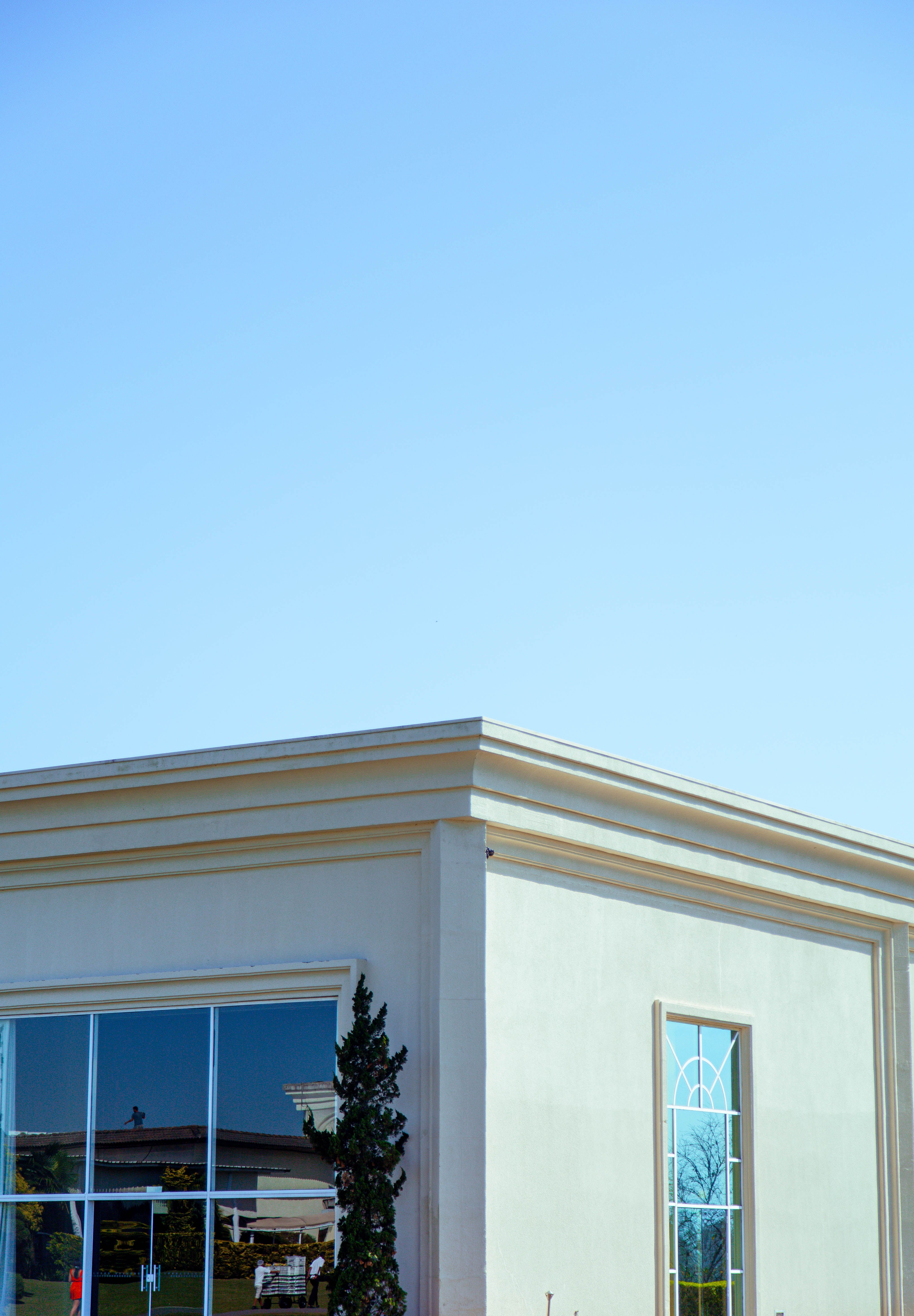 A Building Exterior in City under Blue Sky · Free Stock Photo