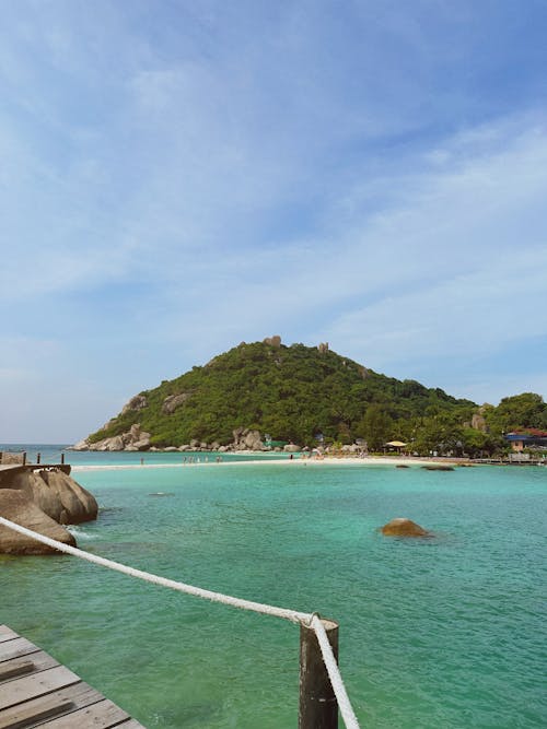 Photo of a Pier with a View of an Island 