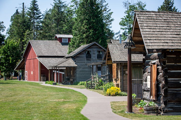 Wooden Cabins And A Barn 