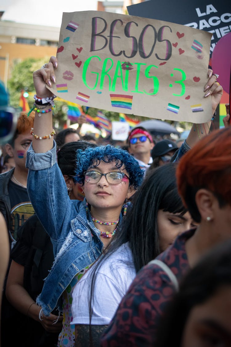 Woman With Banner In Crowd