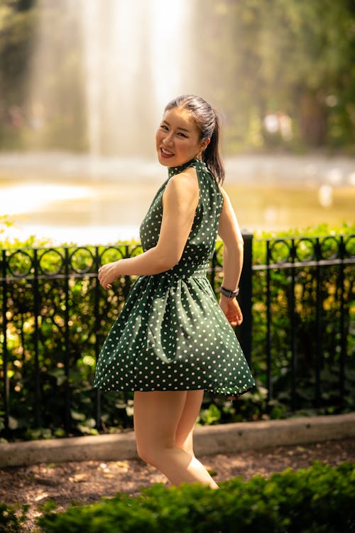 Portrait of a Pretty Brunette Wearing a Green Polka Dot Dress