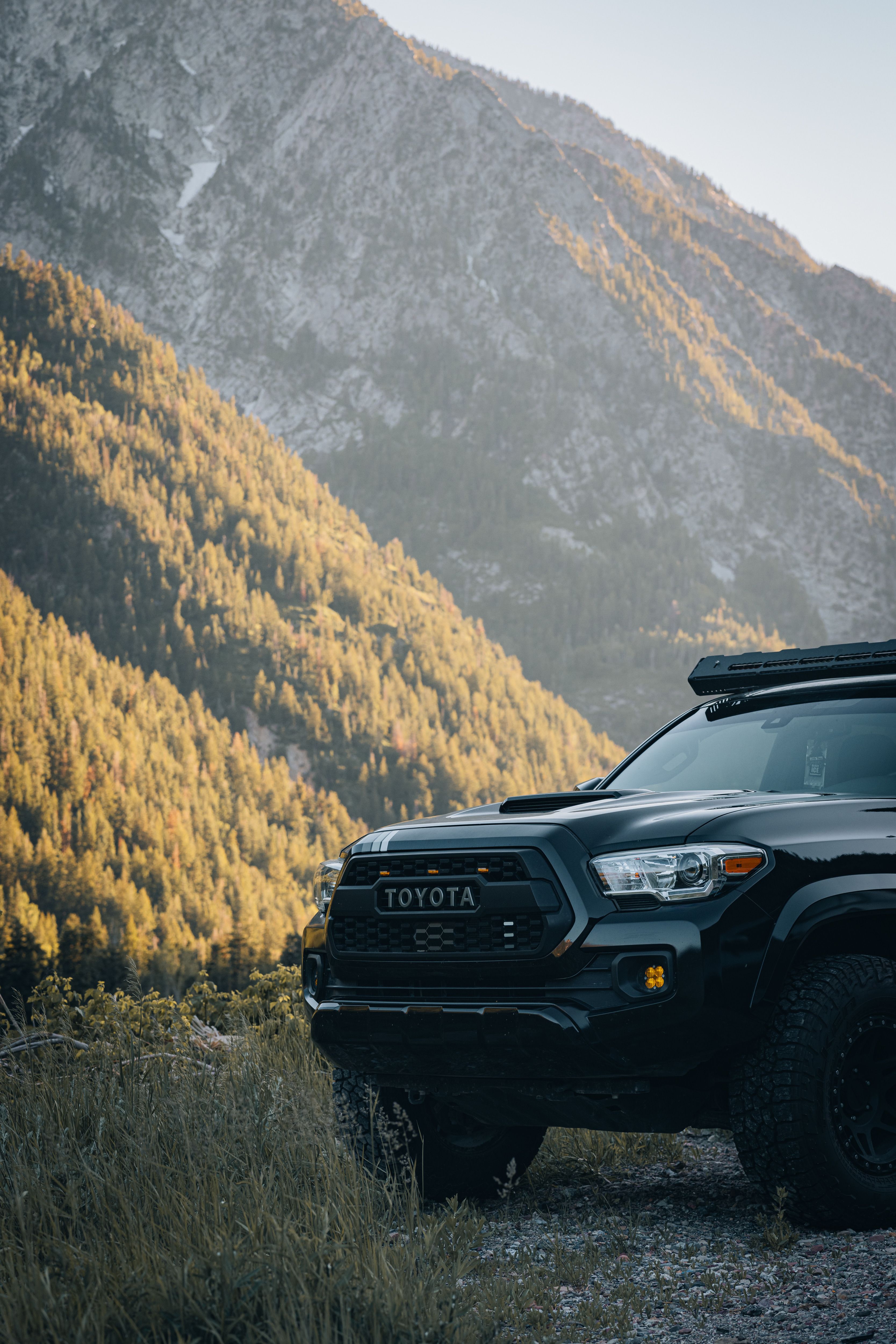 Free Explore scenic mountain drives with this Toyota Tacoma amidst stunning landscapes. Stock Photo