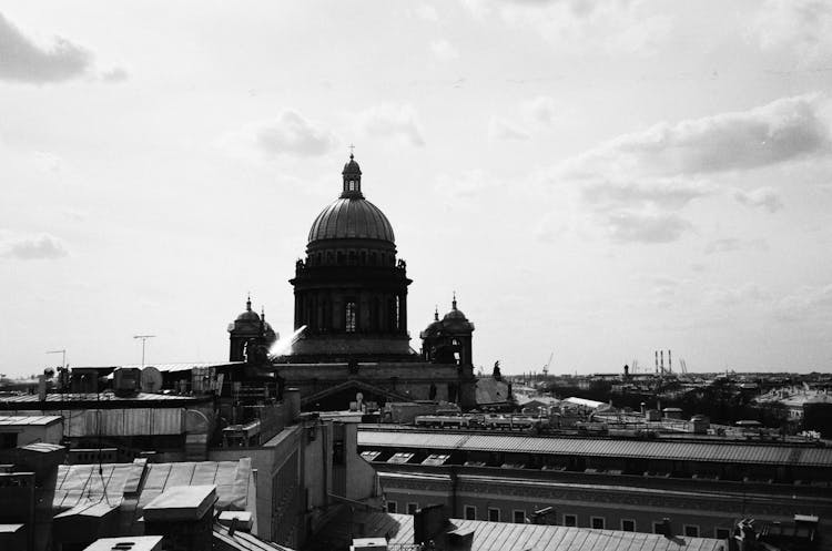 Church Dome Over Roofs Of Buildings In City 