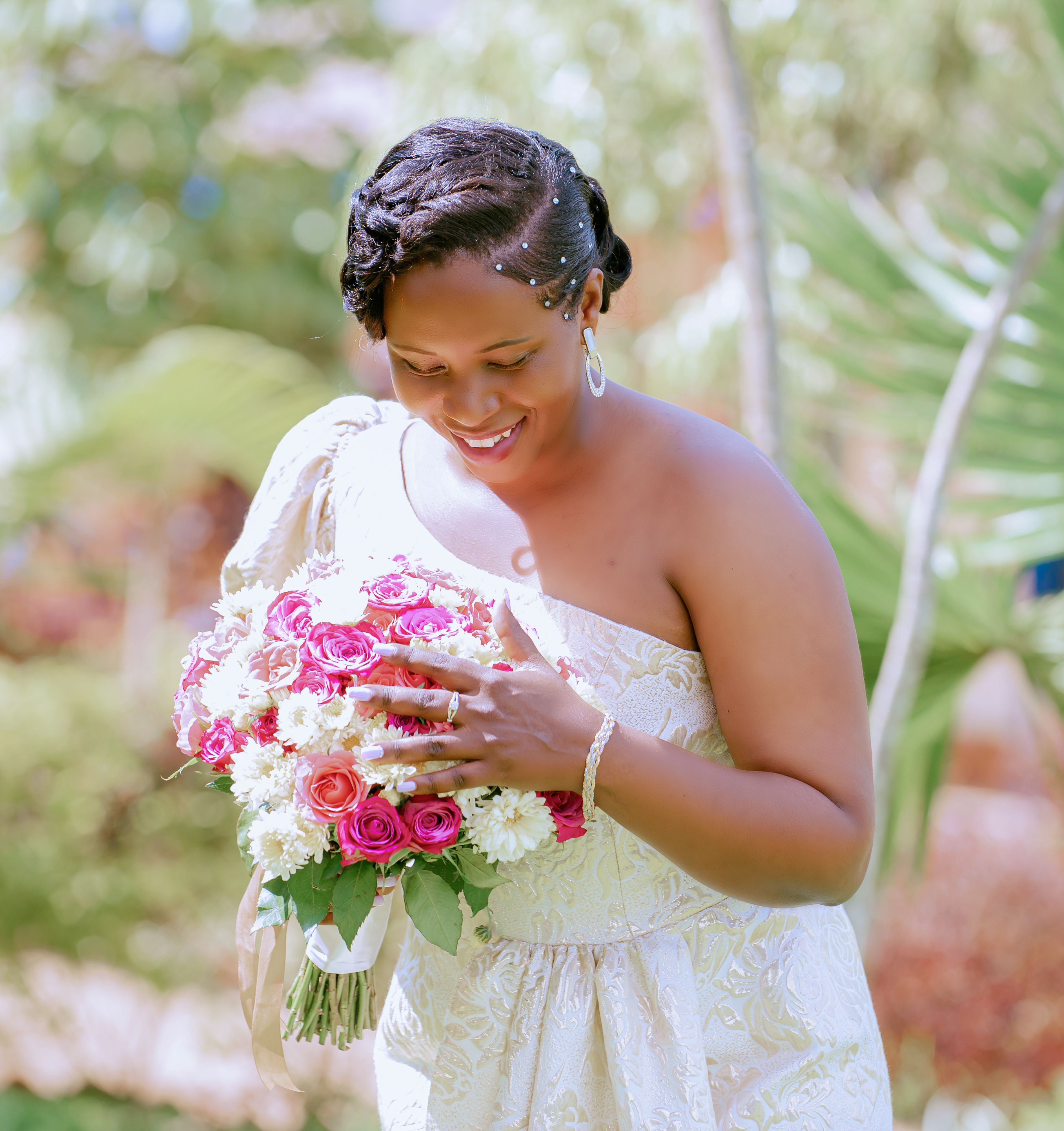 Smiling Bride with a Bouquet of Flowers · Free Stock Photo