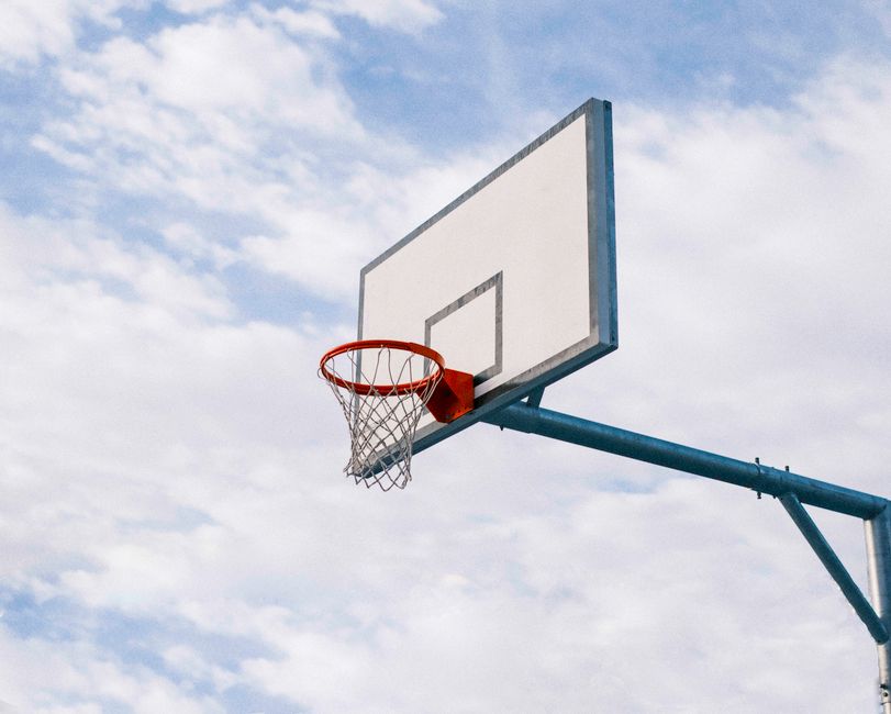 Outdoor basketball hoop on a clear day in Brisbane, symbolizing sport and athleticism.