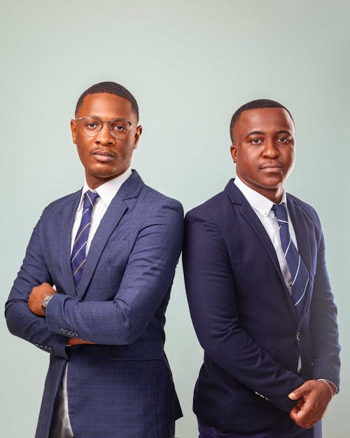 Free Men in Suits Standing by Each Other Stock Photo