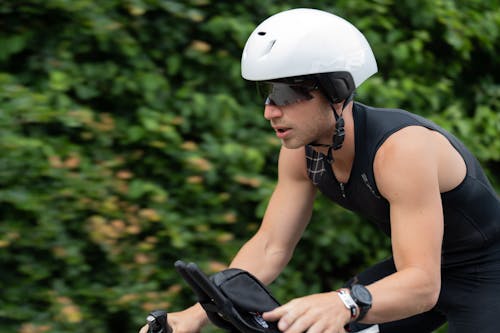 Man in a Helmet Riding a Bike