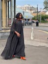 Woman Walking in Black Dress
