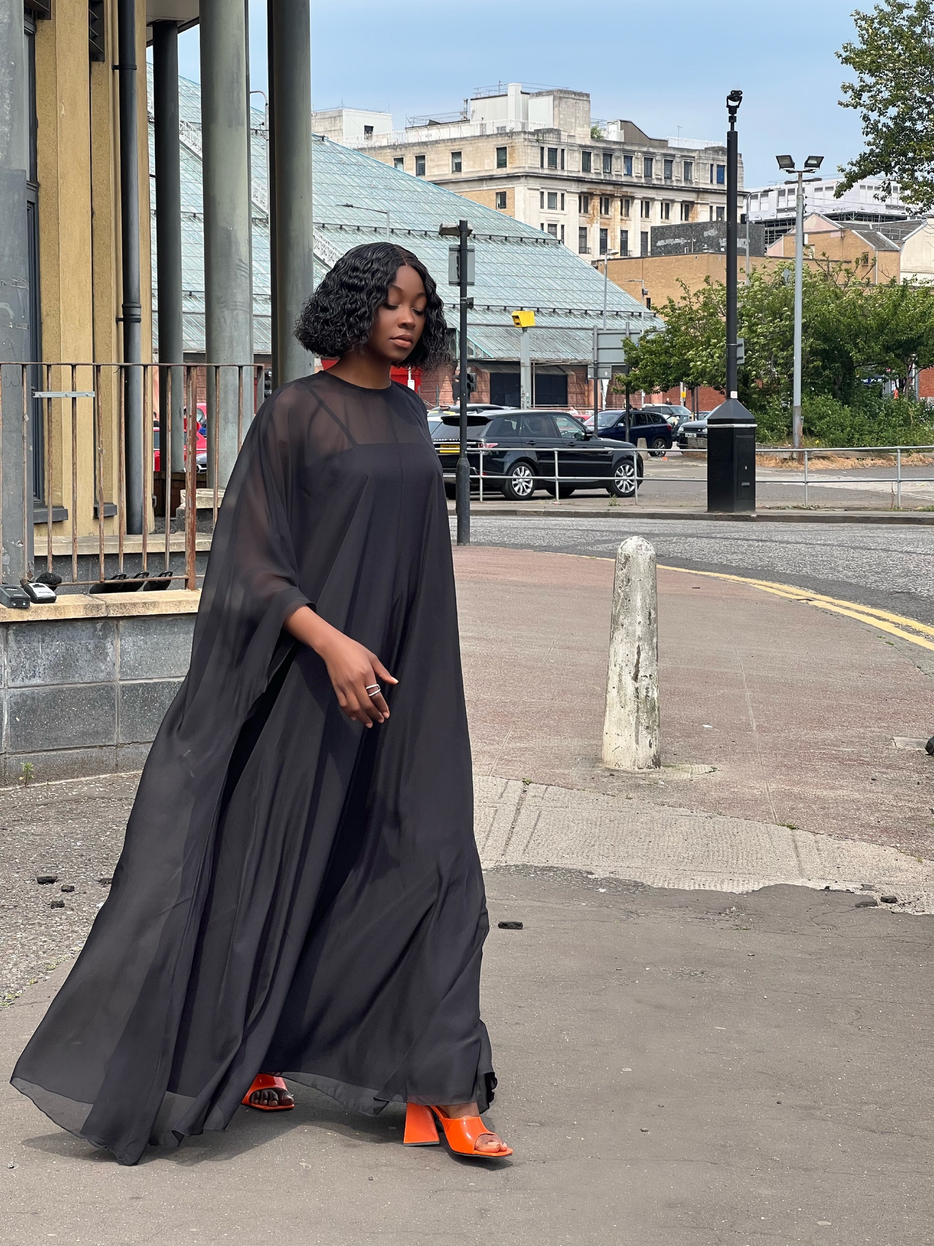 Woman Walking in Black Dress  Free Stock Photo