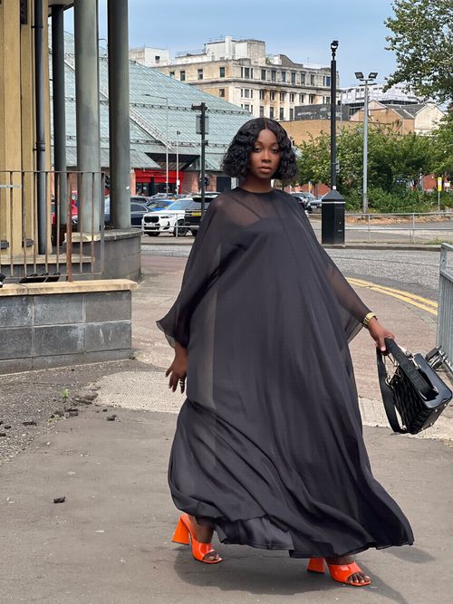 Free Elegant black woman walking in Glasgow, showcasing urban fashion style. Stock Photo