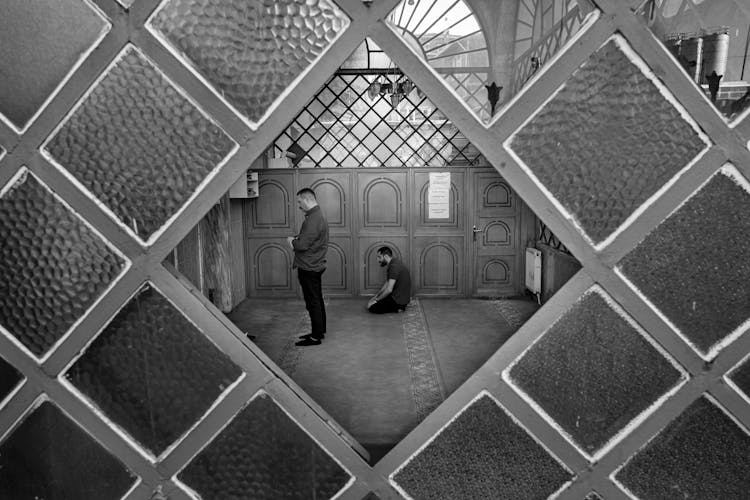 People Praying In Church In Black And White