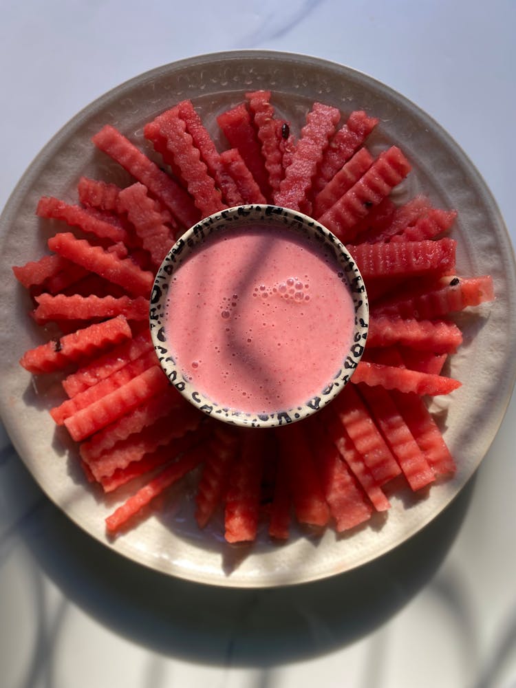 Watermelon Served With A Pink Sauce