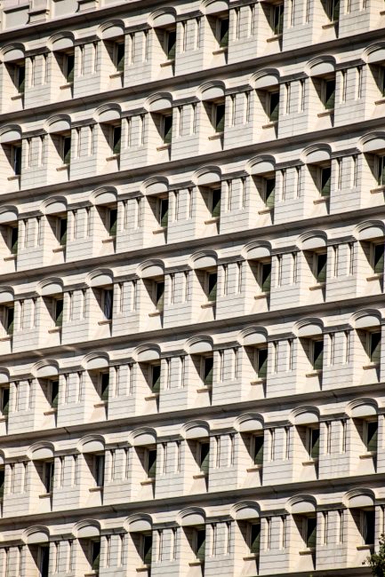 Close-up view of modern architectural facade in Dubai featuring window patterns.