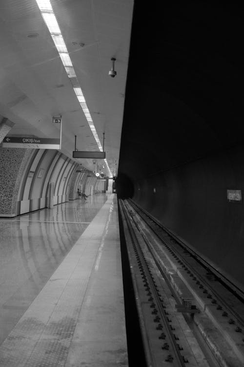 Symmetrical View of an Empty Subway Station and the Railway 