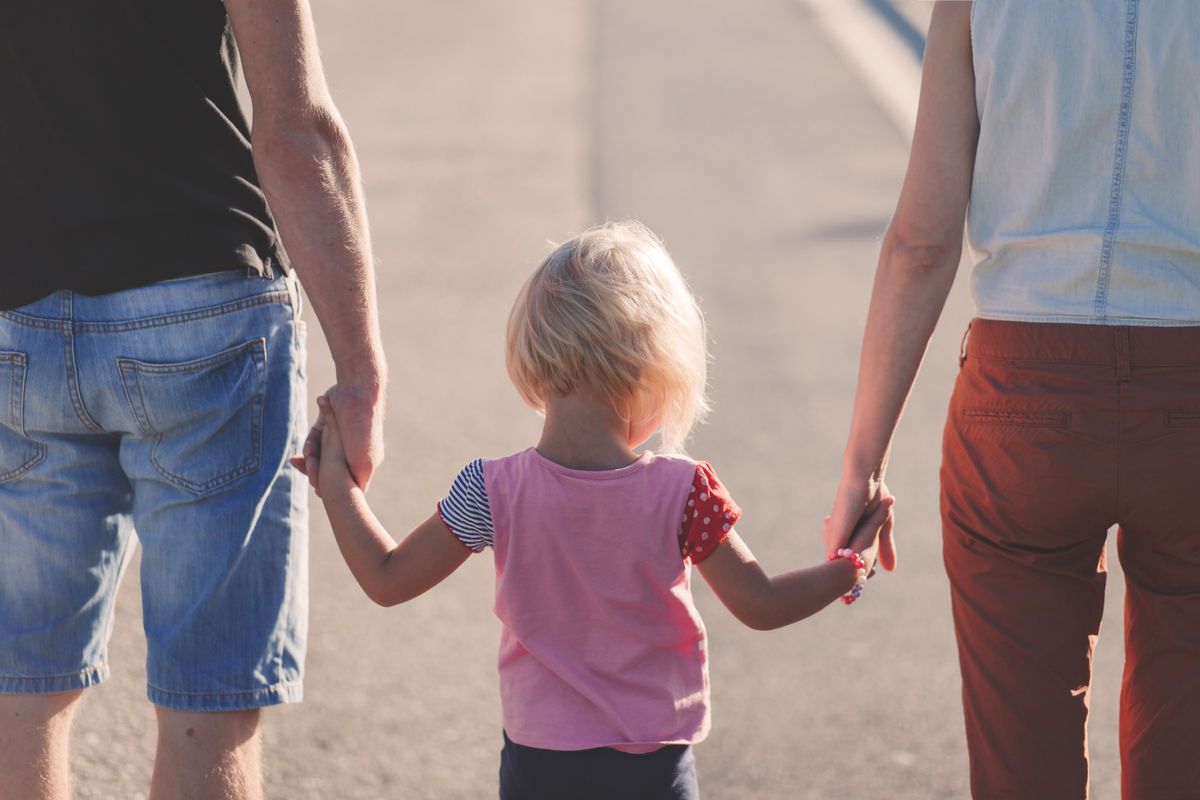 A family walking together outdoors, representing the community supporting Beyond Voice