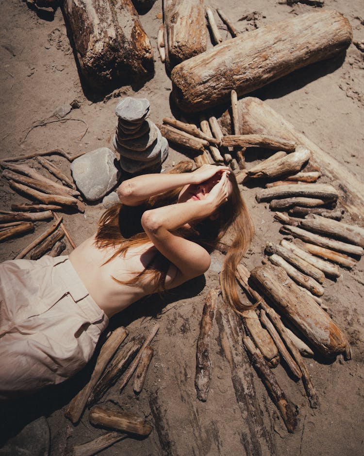 A Blonde Woman Posing In A Hut