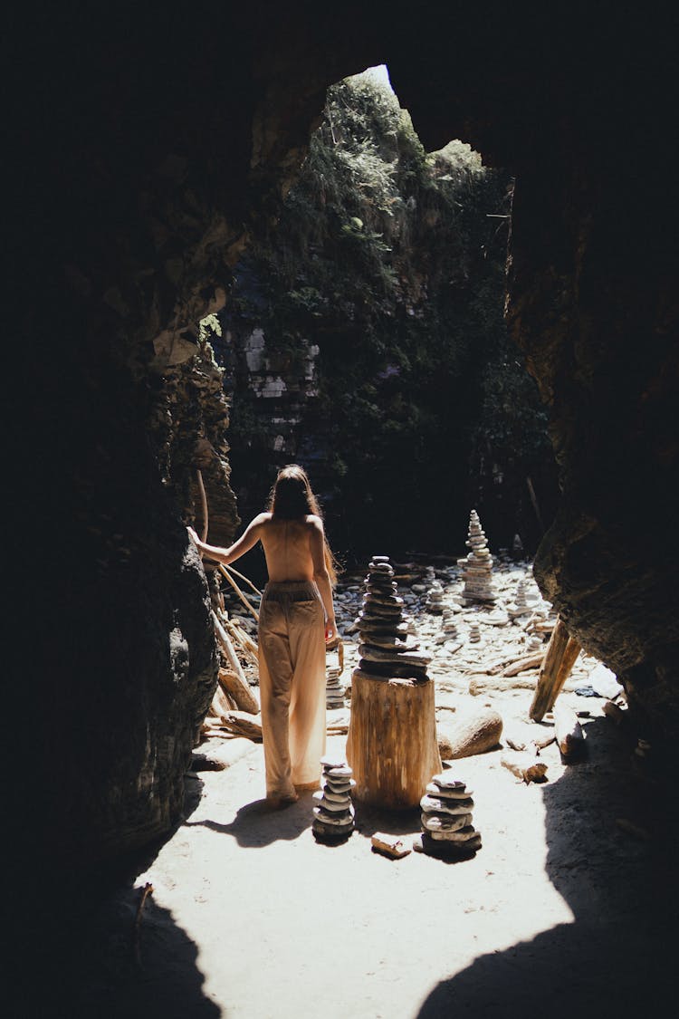 A Blonde Woman In A Rocky Cave