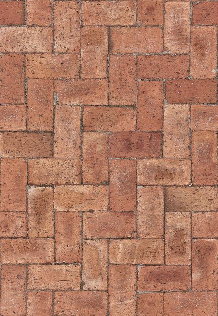 Close-up of red bricks laid in a classic herringbone pattern. Ideal for design projects.