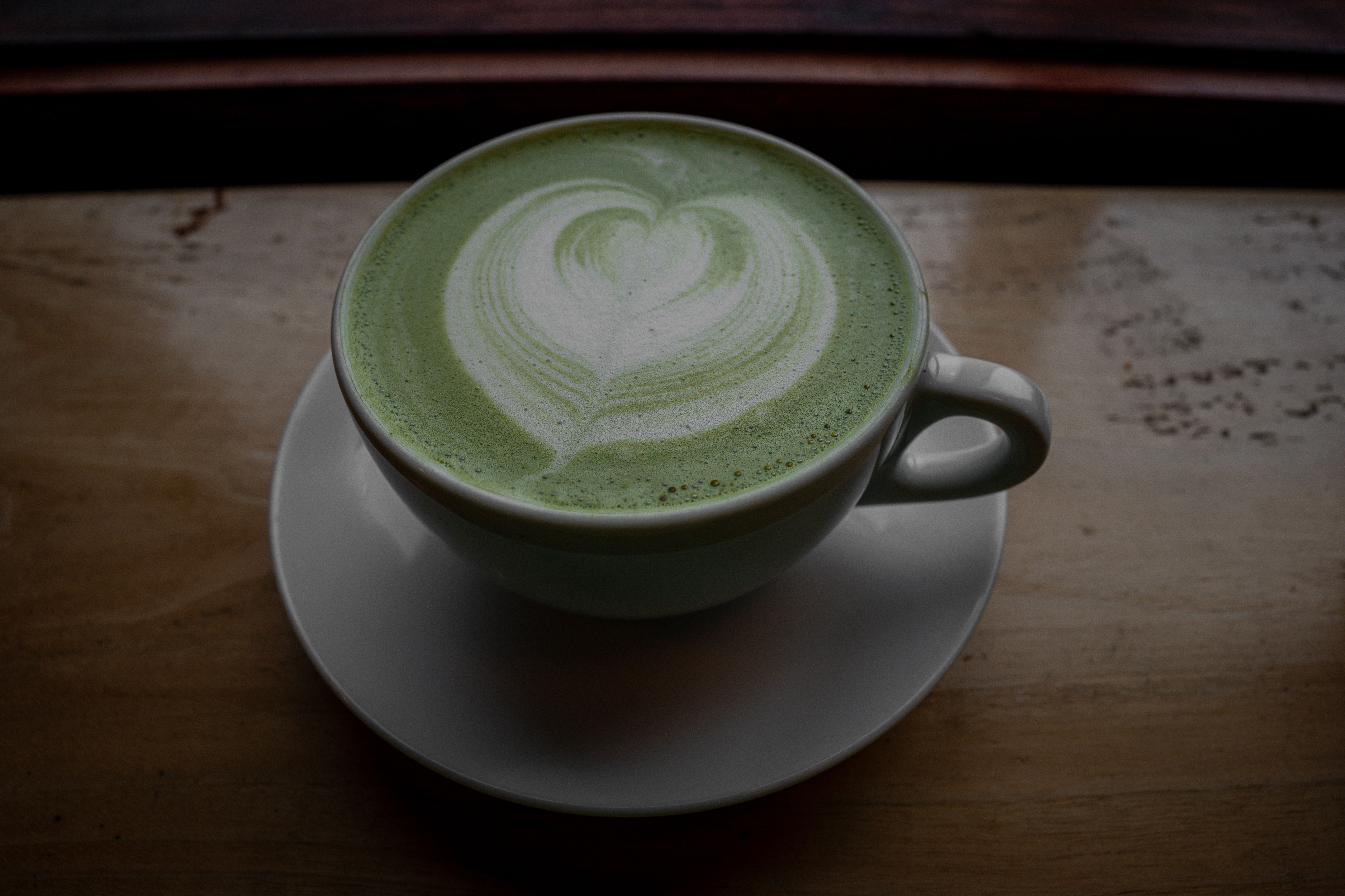 Whisked matcha latte in a white cup, photo by Connor Scott McManus on Pexels