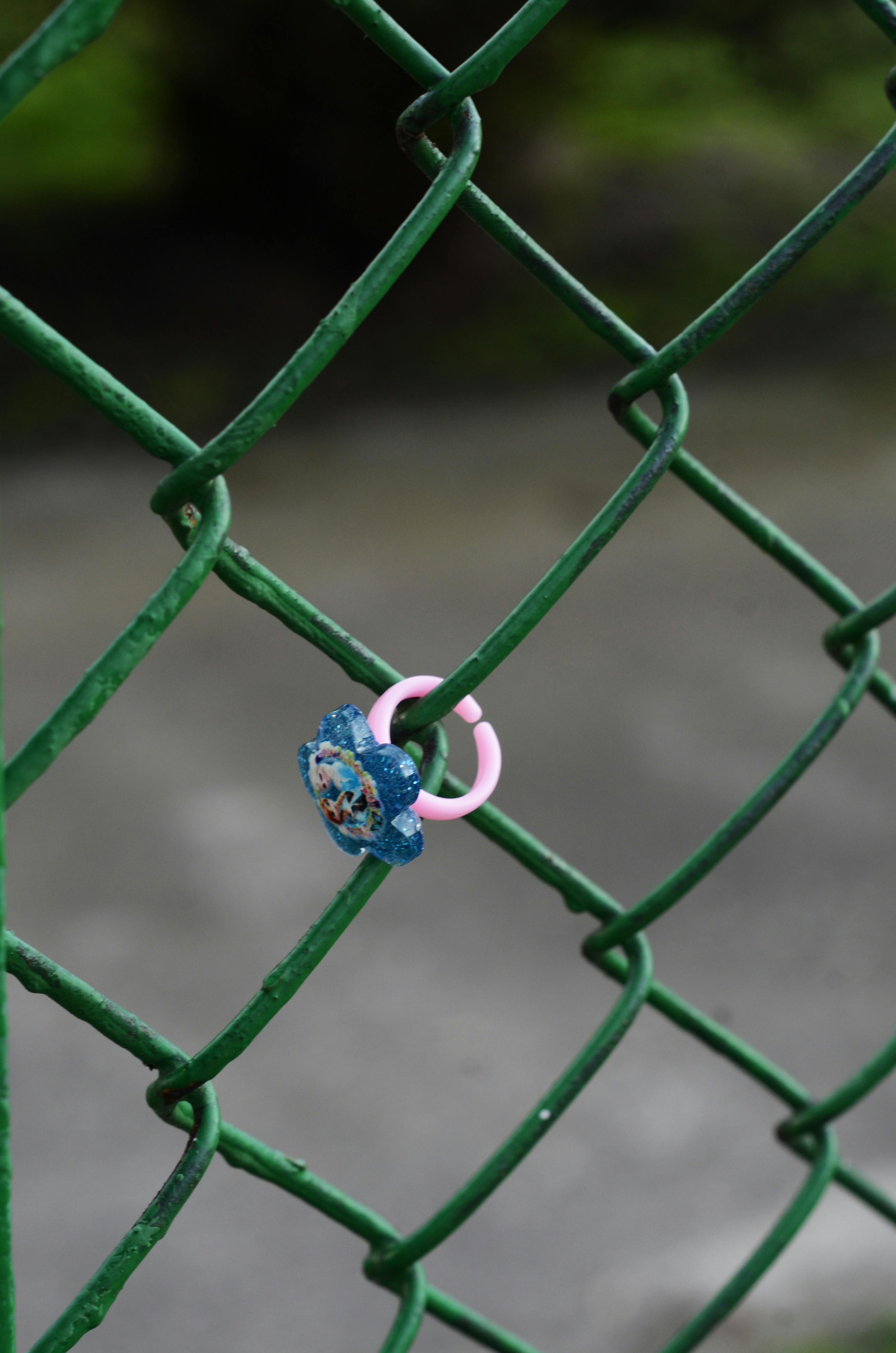 toy ring on a fence