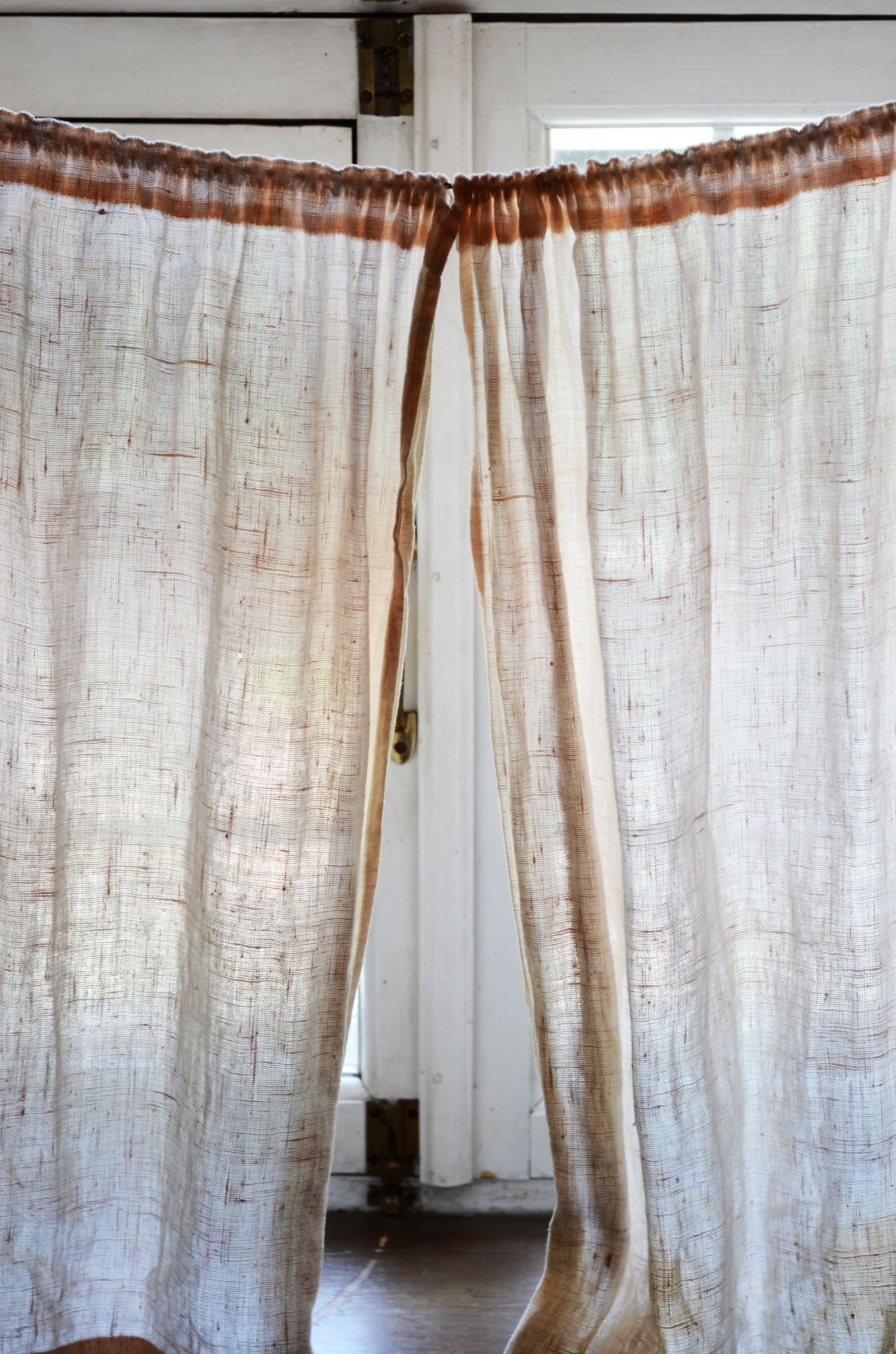 Decorative curtain tiebacks holding elegant curtains