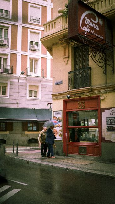 A bustling street scene on Gran Vía showing the impact of Madrid traffic restrictions on urban life.