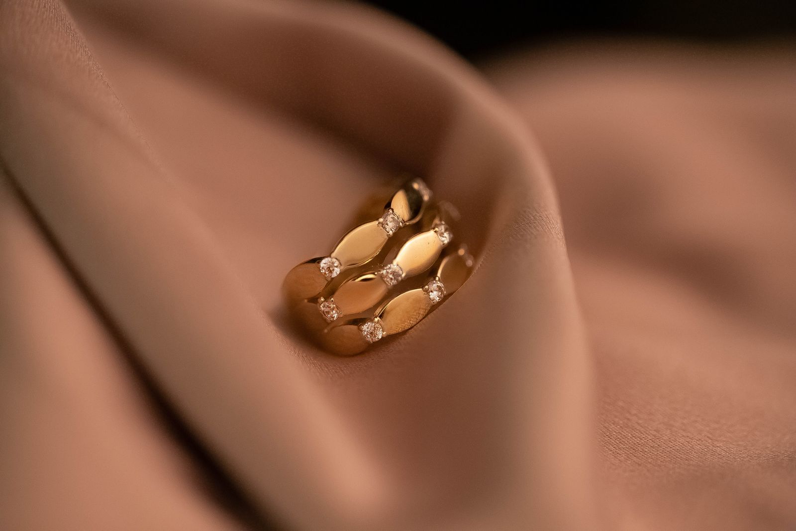 Gold and diamond ring photographed by Maryam, Pexels.