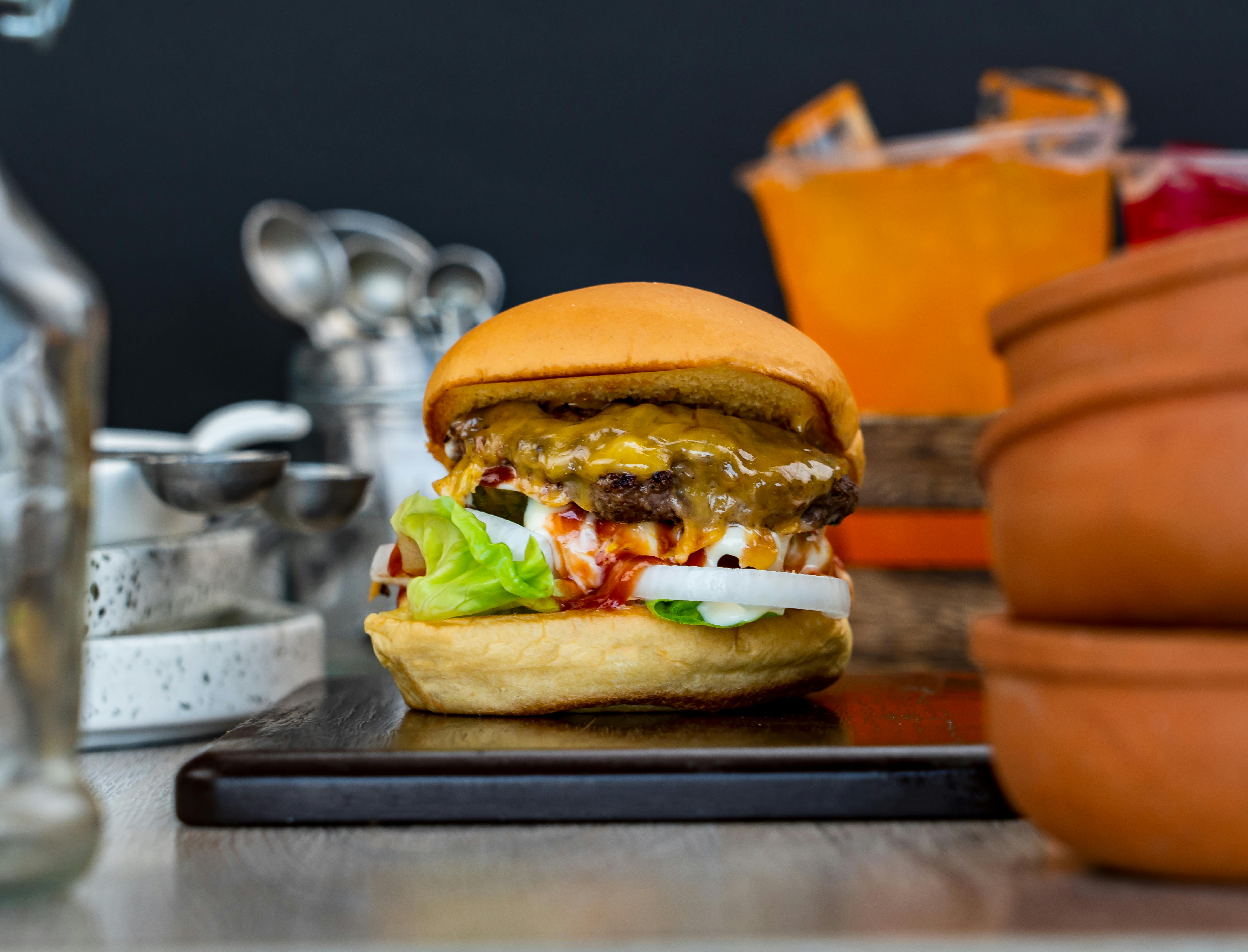 Tasty Burger on Black Tray · Free Stock Photo