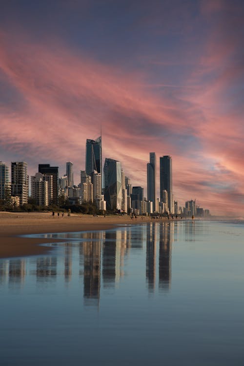 City Skyscrapers behind Beach at Dusk