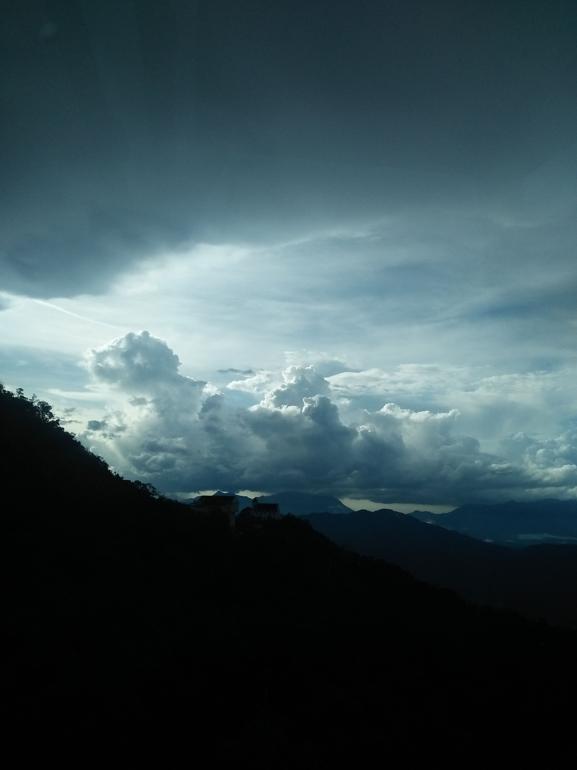 A dramatic view of clouds over a mountain range in Hòa Vang, Vietnam.