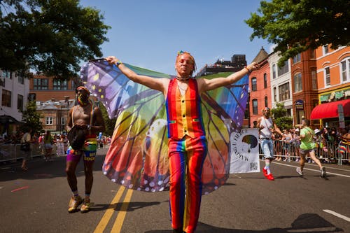 Men in Costumes at a Pride Parade in City 