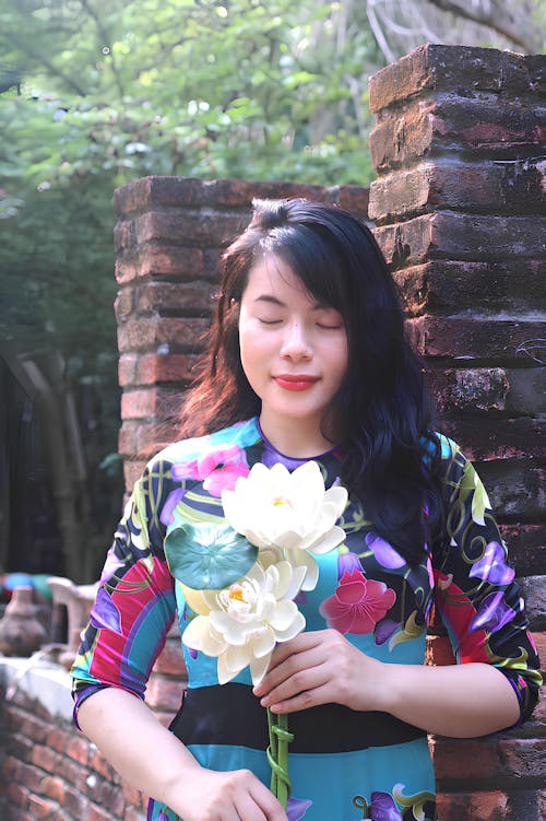 A Woman Holding Flowers 