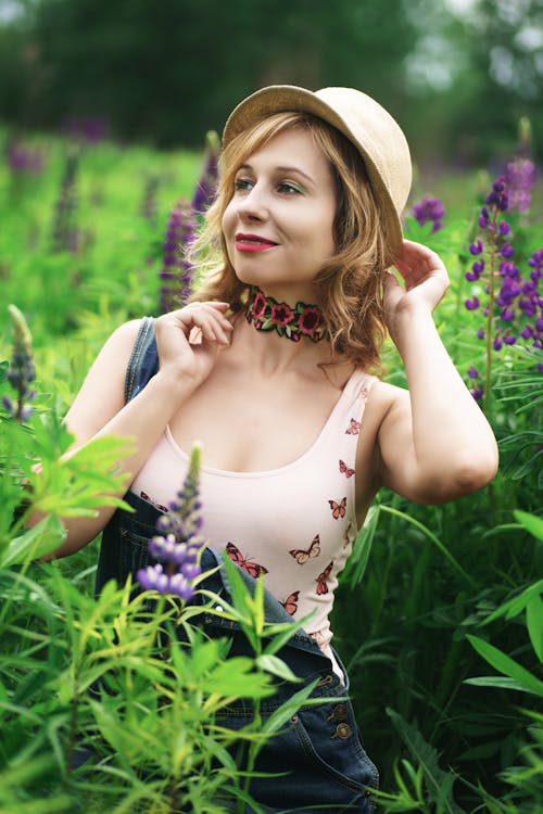 A Woman Wearing a Hat in a Field