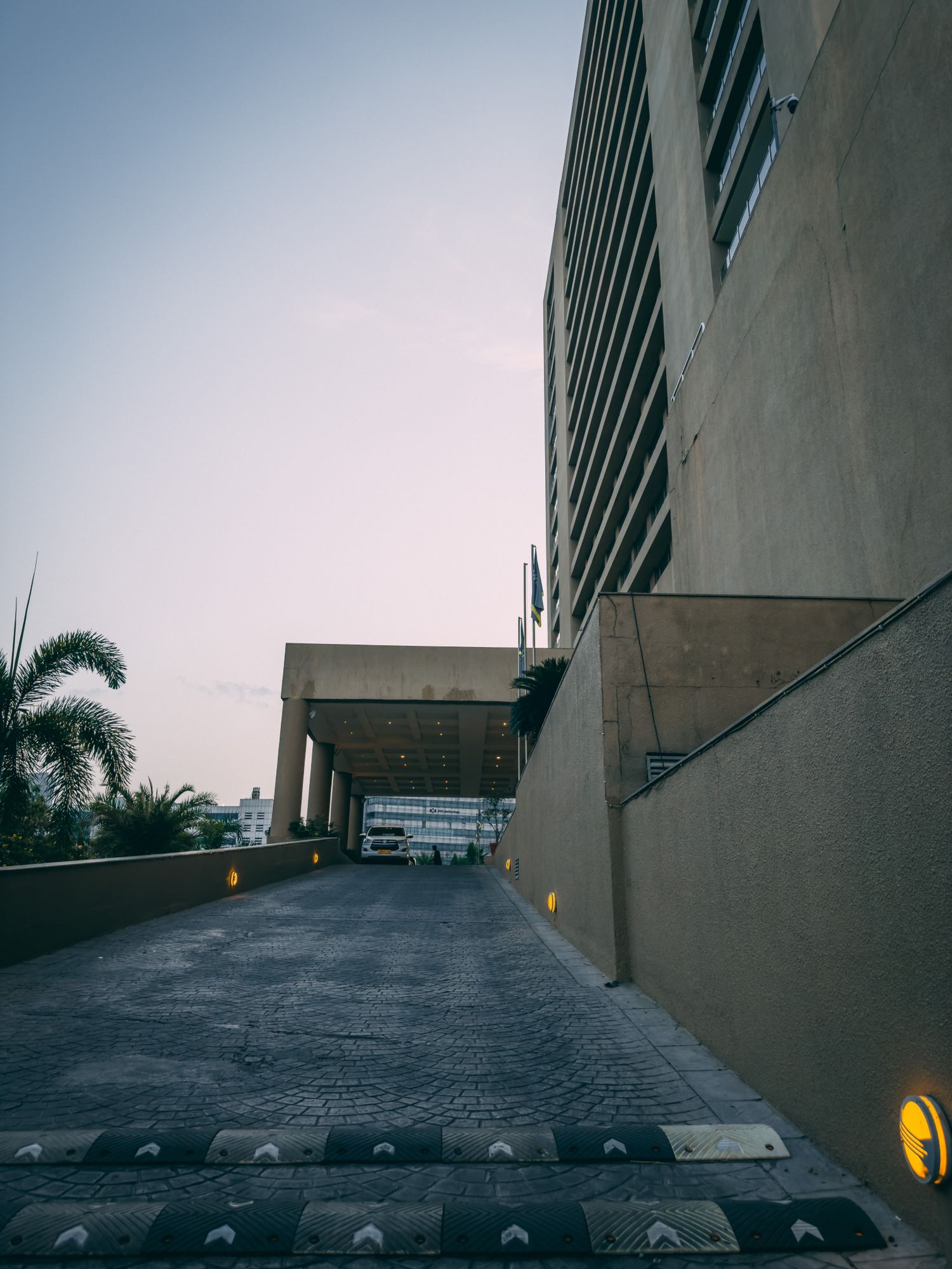 A modern building entrance with a gently sloped ramp leading up to the door