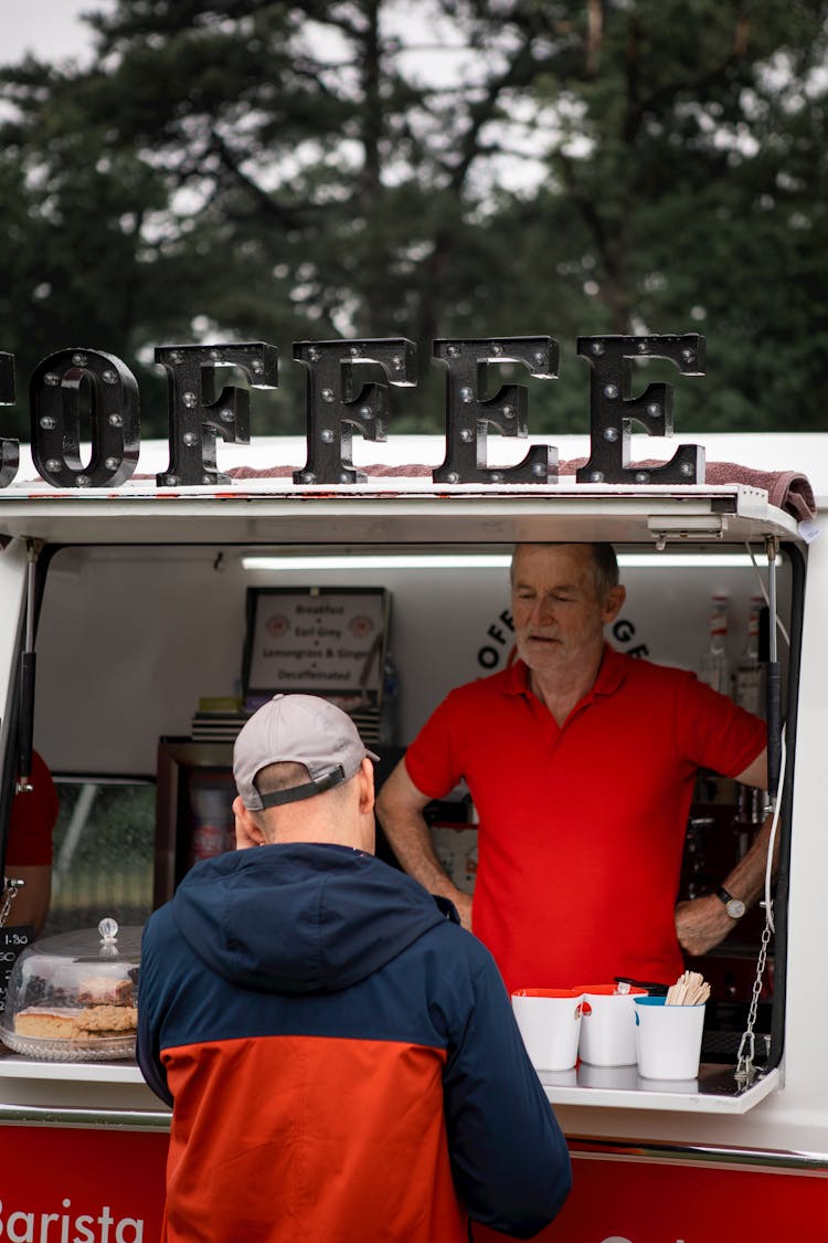 Man Buying Coffee In A Coffee Truck 