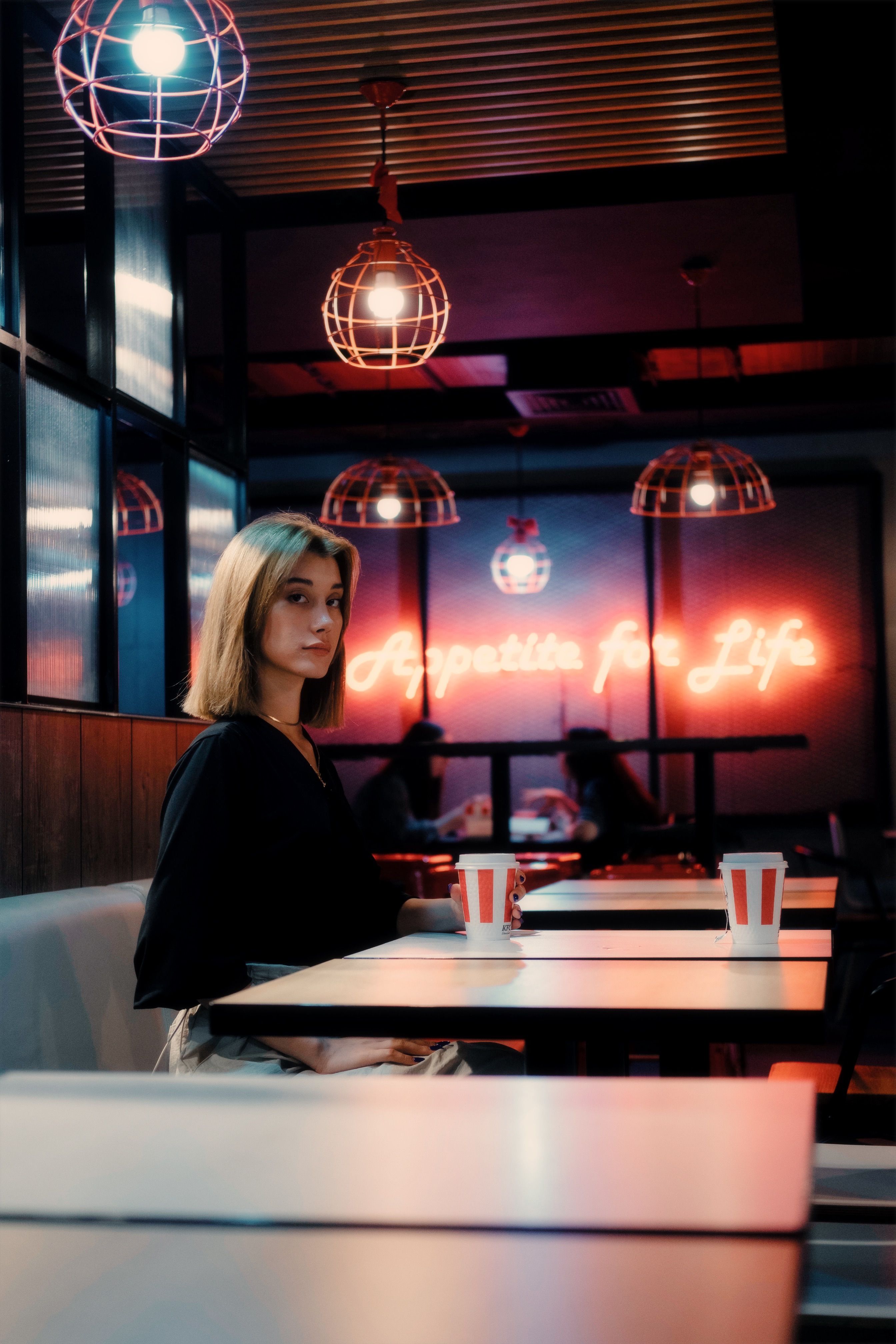 Girl Sitting Alone at the Table in a Restaurant · Free Stock Photo