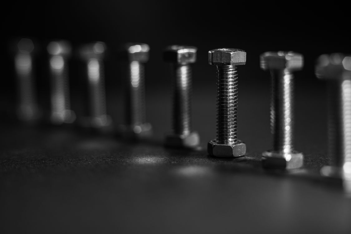 Screw Rows Design Close-up of a Row of Screws · Free Stock Photo