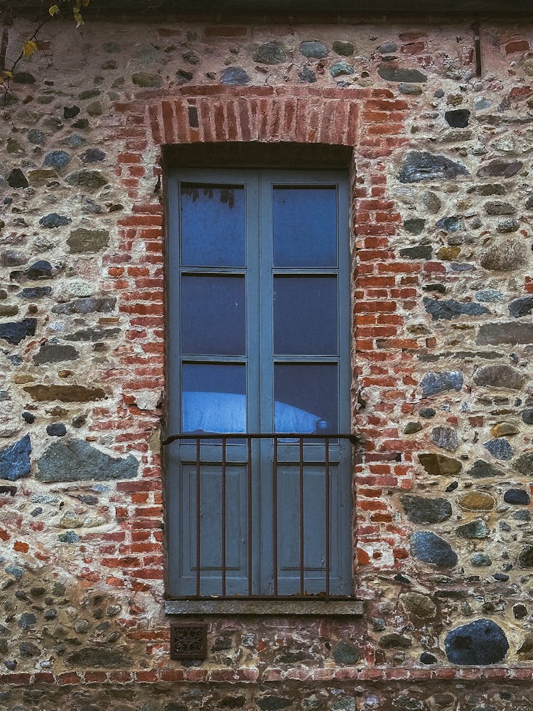 Wall Of An Old Building With A Window 