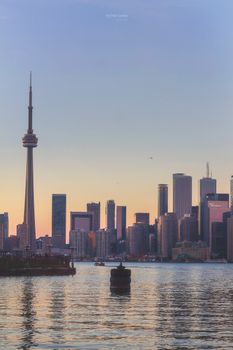 Beautiful sunset view of Toronto's skyline featuring the iconic CN Tower and waterfront.