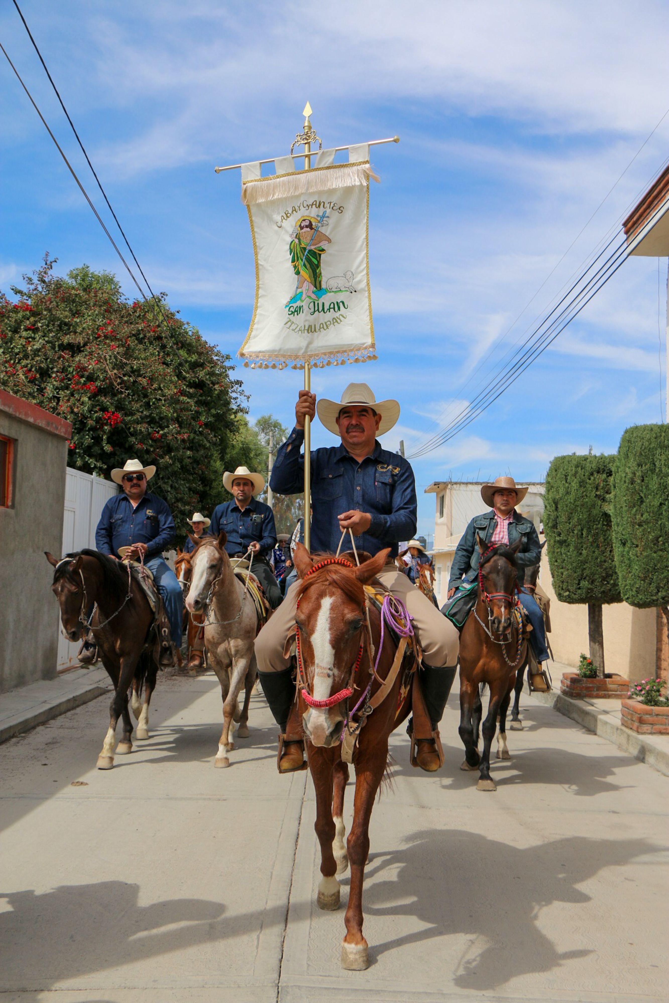 Riders on horses participate in a traditional parade in San Juan Tizahuapan, México.