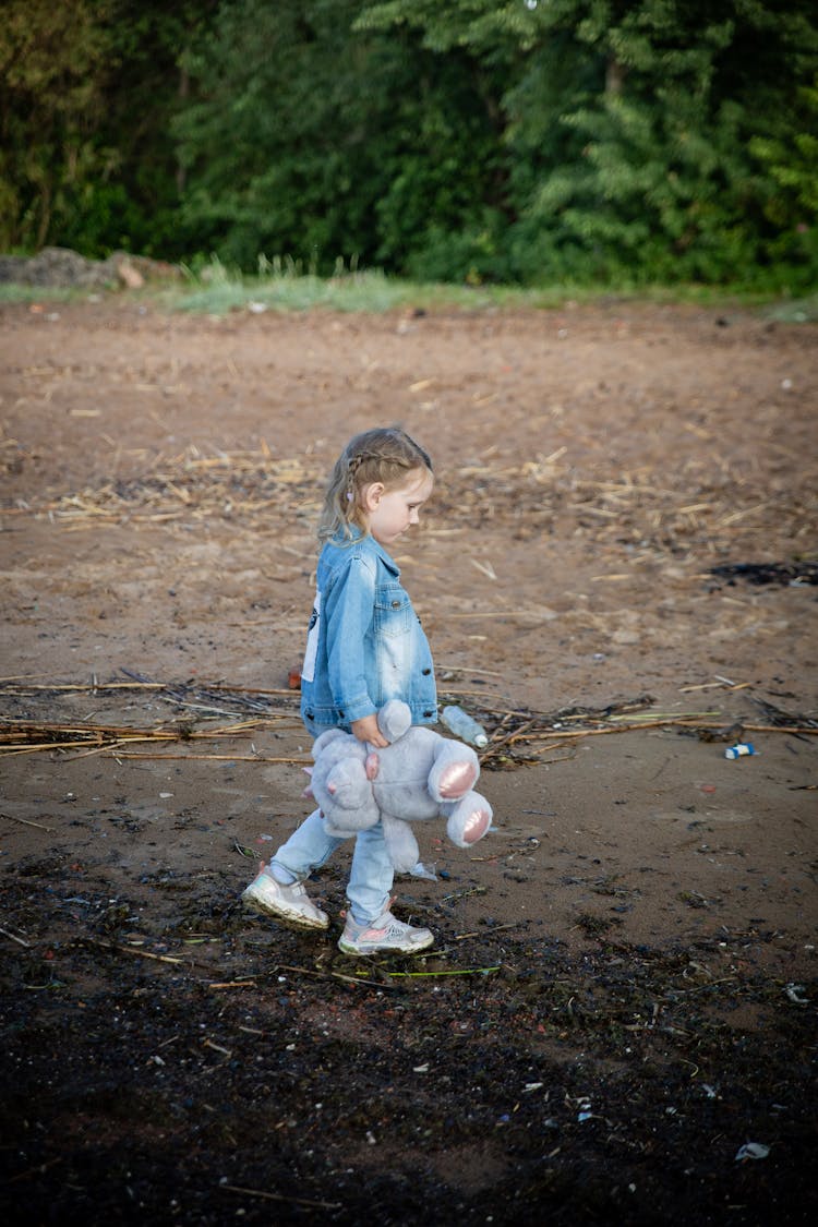 Girl Walking With Teddy Bear